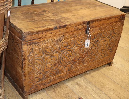 An 18th century Scandinavian softwood chest, the front carved with stylised rosettes W.94cm